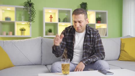 Affected-man-drinks-alcohol-and-talks-to-himself.